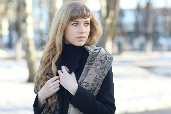 Girl in coat and scarf outside — Stock Photo, Image