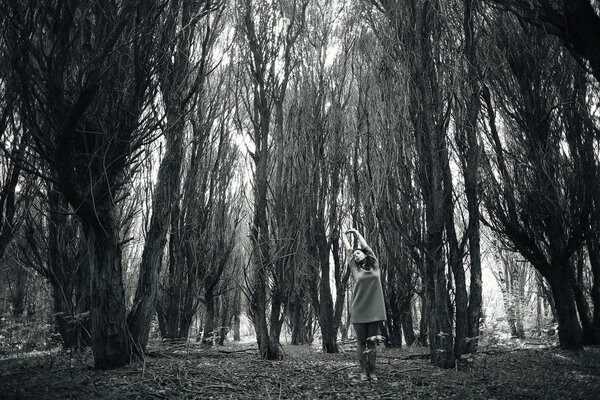 Young brunette woman in the forest ,black and white