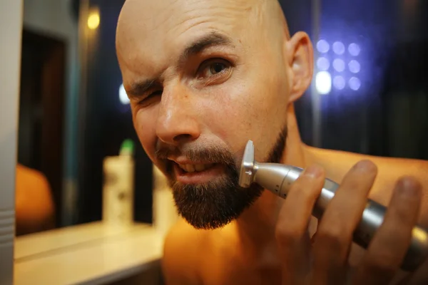 Portrait of a man shaving trimer — Stock Photo, Image