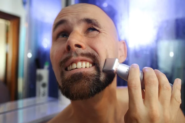 Portrait of a man shaving trimer — Stock Photo, Image