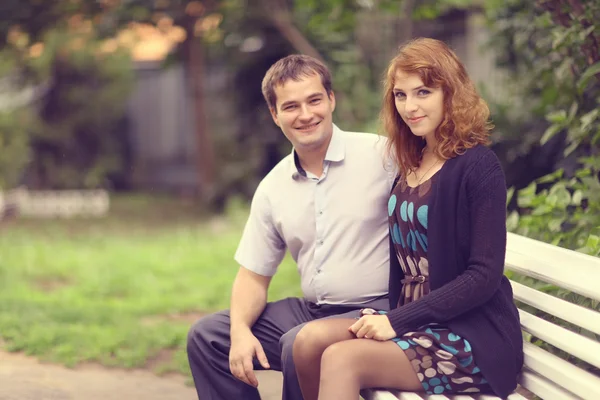 Young couple hugging in the park summer — Stock Photo, Image