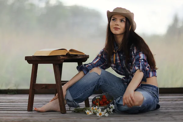 Girl with a book in a rustic style — Stock Photo, Image