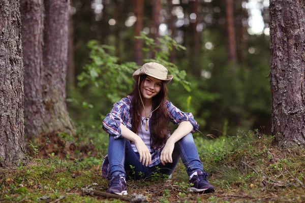 Young girl in the forest ranger — Stock Photo, Image