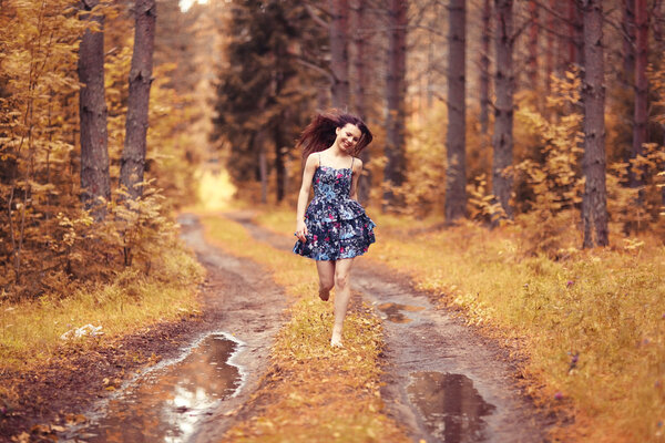 Running girl forester in nature