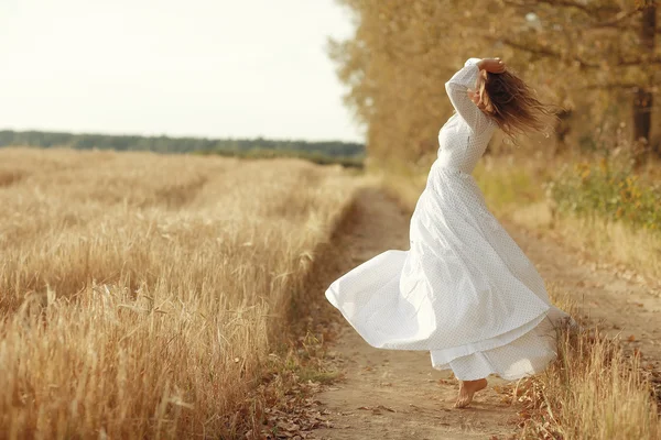 Woman white dress Autumn road — Stock Photo, Image