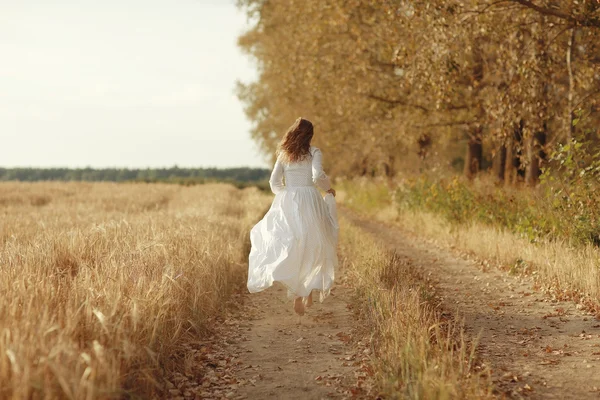 Woman white dress Autumn road — Stock Photo, Image