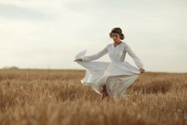 Girl in white dress fall outside — Stock Photo, Image