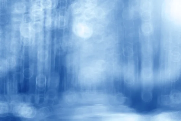 Niebieskie tło zamazane pole bokeh — Zdjęcie stockowe