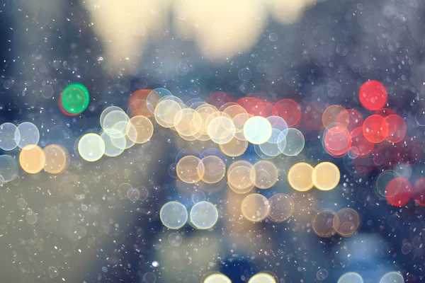 Městské pozadí se světly a sníh — Stock fotografie