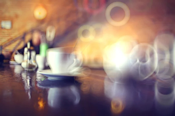 Kopje thee in een cafe wazig achtergrond — Stockfoto