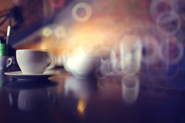 Cup of tea at a cafe blurred background — Stock Photo, Image