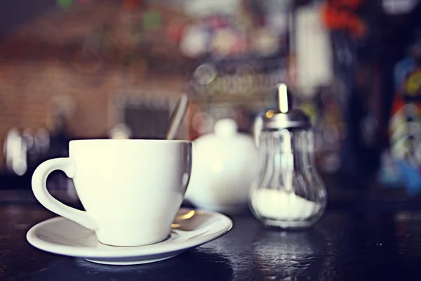 Cup of tea at a cafe blurred background Royalty Free Stock Photos