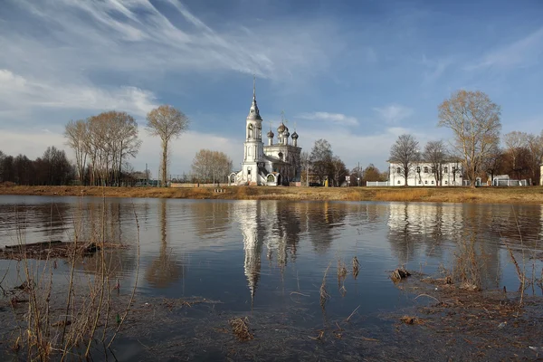 Church on river shore — Stock Photo, Image