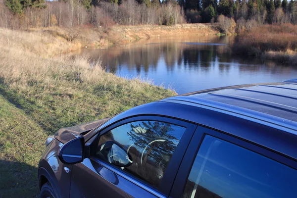 Car in the autumn landscape — Stock Photo, Image