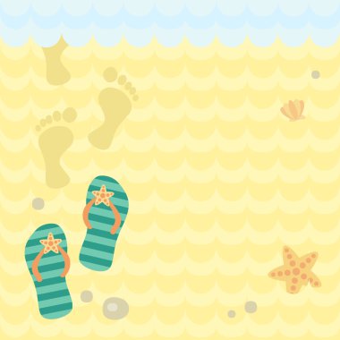 Kum üzerinde plaj tanga ve ayak izleri.