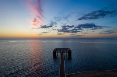 Pier on Mobile Bay at sunset from Daphne, Alabama in October 2020 clipart