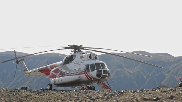 Tolbachik mountain , Russia, September 20, 2020 Modern aircraft and nature helicopter waits for tourists — Stock Video