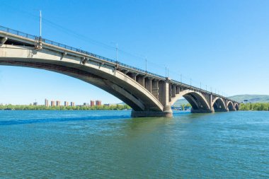 View on Bridge Communal from embankment of the Yenisei river in Krasnoyarsk, Russia in sunny day