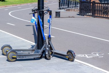 Krasnoyarsk, Russia - 3 June, 2021: scooters for hire at an automatic rental station in Krasnoyarsk.