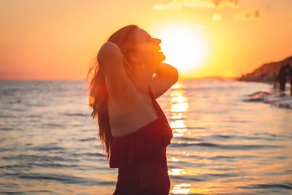 Carefree Woman Red Swimsuit Dancing Sunset Beach Mature Woman Relaxation — Stock Photo, Image