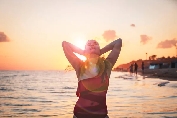 Carefree Woman Red Swimsuit Dancing Sunset Beach Mature Woman Relaxation — Stock Photo, Image