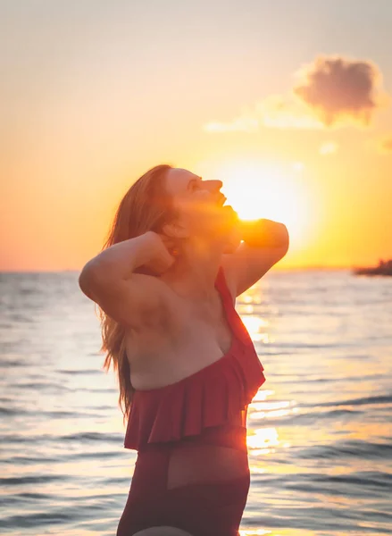 Carefree Woman Red Swimsuit Dancing Sunset Beach Mature Woman Relaxation — Stock Photo, Image