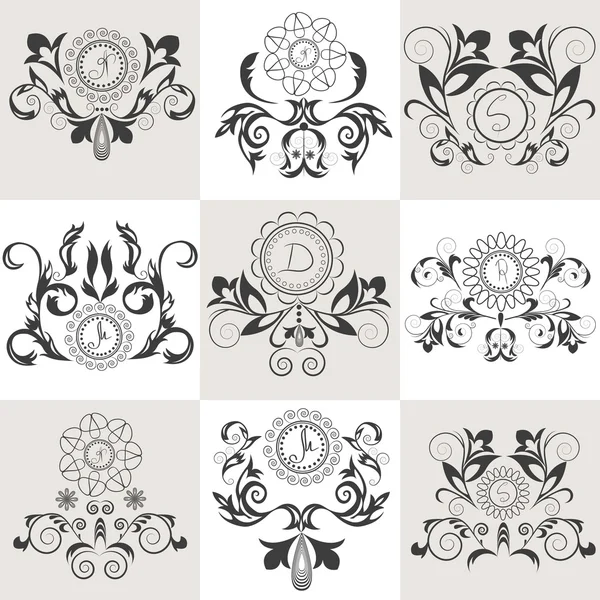 Ensemble d'emblèmes ornement floral — Image vectorielle