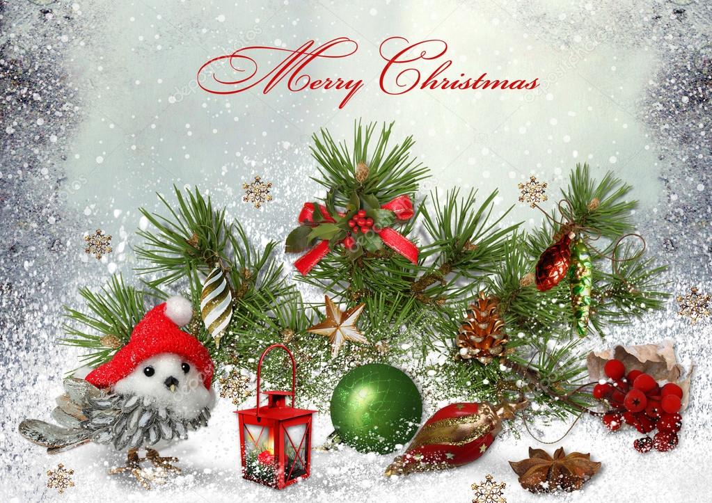 Christmas greeting card with Christmas toys and pine branches
