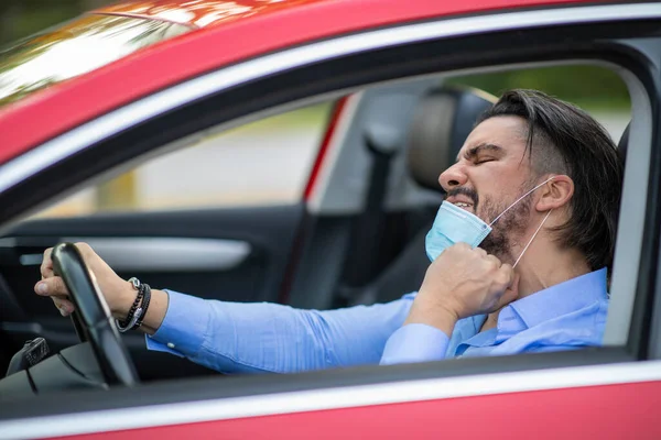 Angry Driver Pulling Corona Mask While Driving — Stock Photo, Image