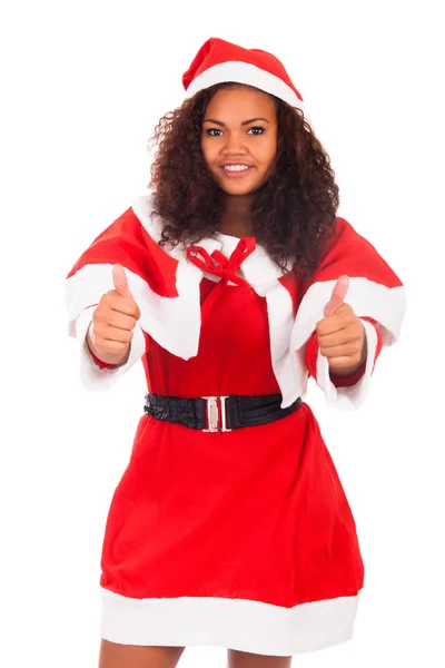 Mujer de Navidad haciendo un gesto hacia arriba pulgares contra un fondo blanco —  Fotos de Stock