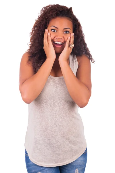 Young African woman looking surprised on white background — Stock Photo, Image