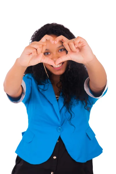 Hermosa joven mujer haciendo un corazón con las manos — Foto de Stock