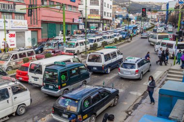 Traffic on a main road Avenida Ismael Montes in La Paz clipart