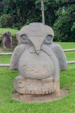 Ancient statues in archeological park in San Agustin clipart