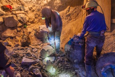 POTOSI, BOLIVIA - APRIL 20, 2015: Bolivian miners work inside Cerro Rico mine in Potosi, Bolivia. clipart