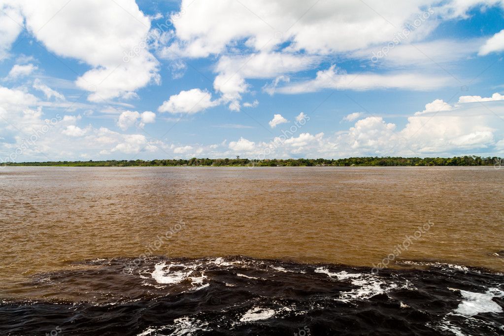 The Meeting of Waters (Encontro das Aguas) is the confluence between the Rio Negro river, with dark water, and lighter Amazon river or Rio Solimoes