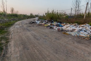 Road through a landfill in Rasht, Iran clipart