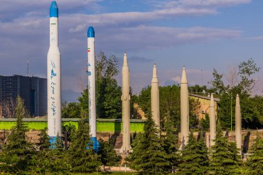 TEHRAN, IRAN - APRIL 14, 2018: Various missiles exhibited at the Islamic Revolution and Holy Defense Museum in Tehran, Ira clipart