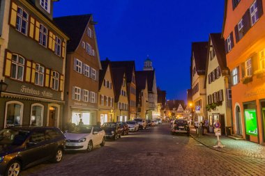 DINKELSBUHL, GERMANY - AUGUST 28, 2019: Evening view of a street in Dinkelsbuhl, Bavaria state, Germany