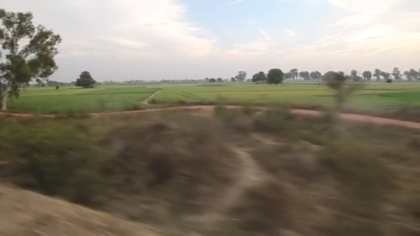 View from a riding train in India Royalty Free Stock Video