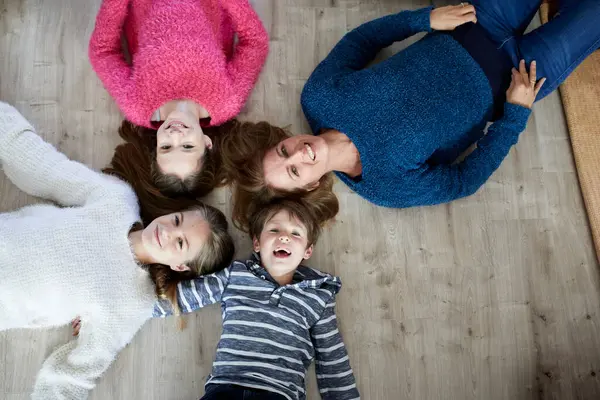 Happy Family Lying Floor Laughing — Stock Photo, Image