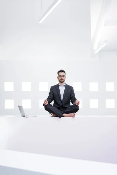 Businessman Doing Yoga Office Next Laptop — Stock Photo, Image