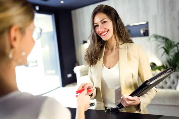 Smiling Businesswoman Handing Credit Card Reception — Stock Photo, Image