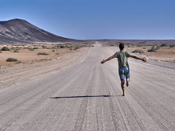 Man Running Freely Endless Road Rear View Damaraland Namibia — Stock Photo, Image
