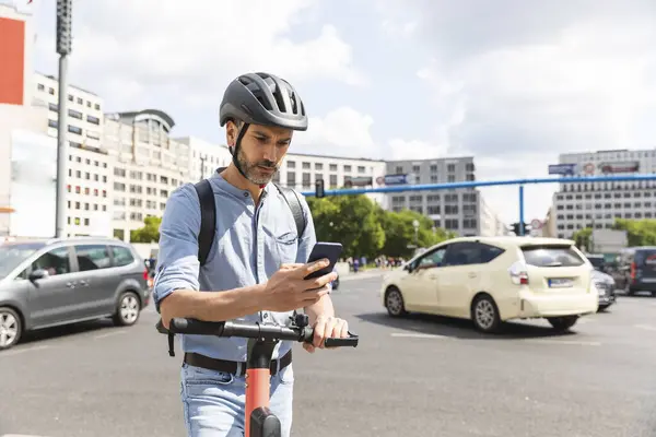 Businessman Looking Smartphone Commuting Electric Scooter City Berlin Germany — Stock Photo, Image