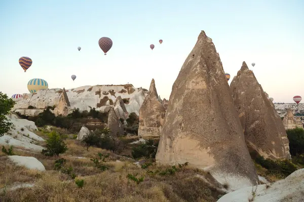Hot Air Balloons Flying Rocky Landscape Clear Sky Cappadocia Turkey — Stock Photo, Image