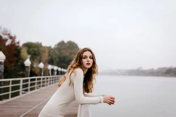 Portrait Young Woman Wearing White Dress Leaning Railing Rainy Day — Stock Photo, Image