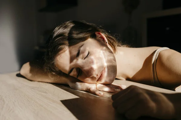 Portrait Young Woman Eyes Closed Leaning Wooden Table Sunlight — Stock Photo, Image