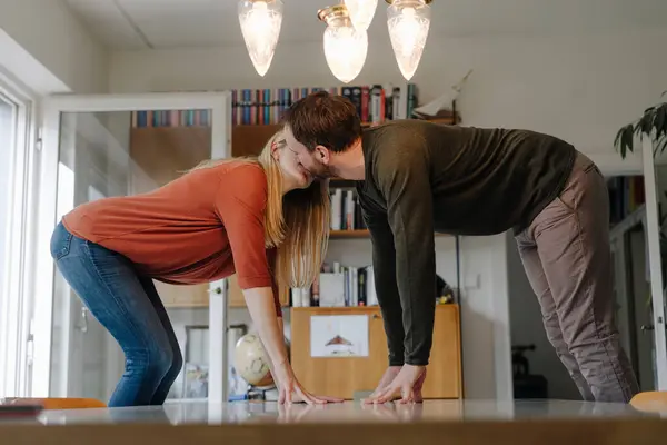 Couple Standing Chairs Kissing Leaning Dining Table — Stock Photo, Image