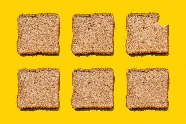 Studio Shot Six Slices Wheat Bread Yellow Background — Stock Photo, Image